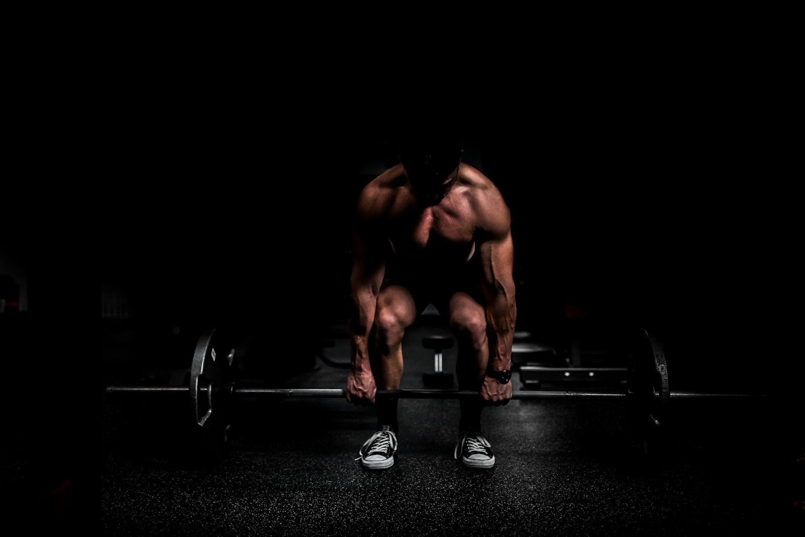 Strength coach working an athlete on the platform